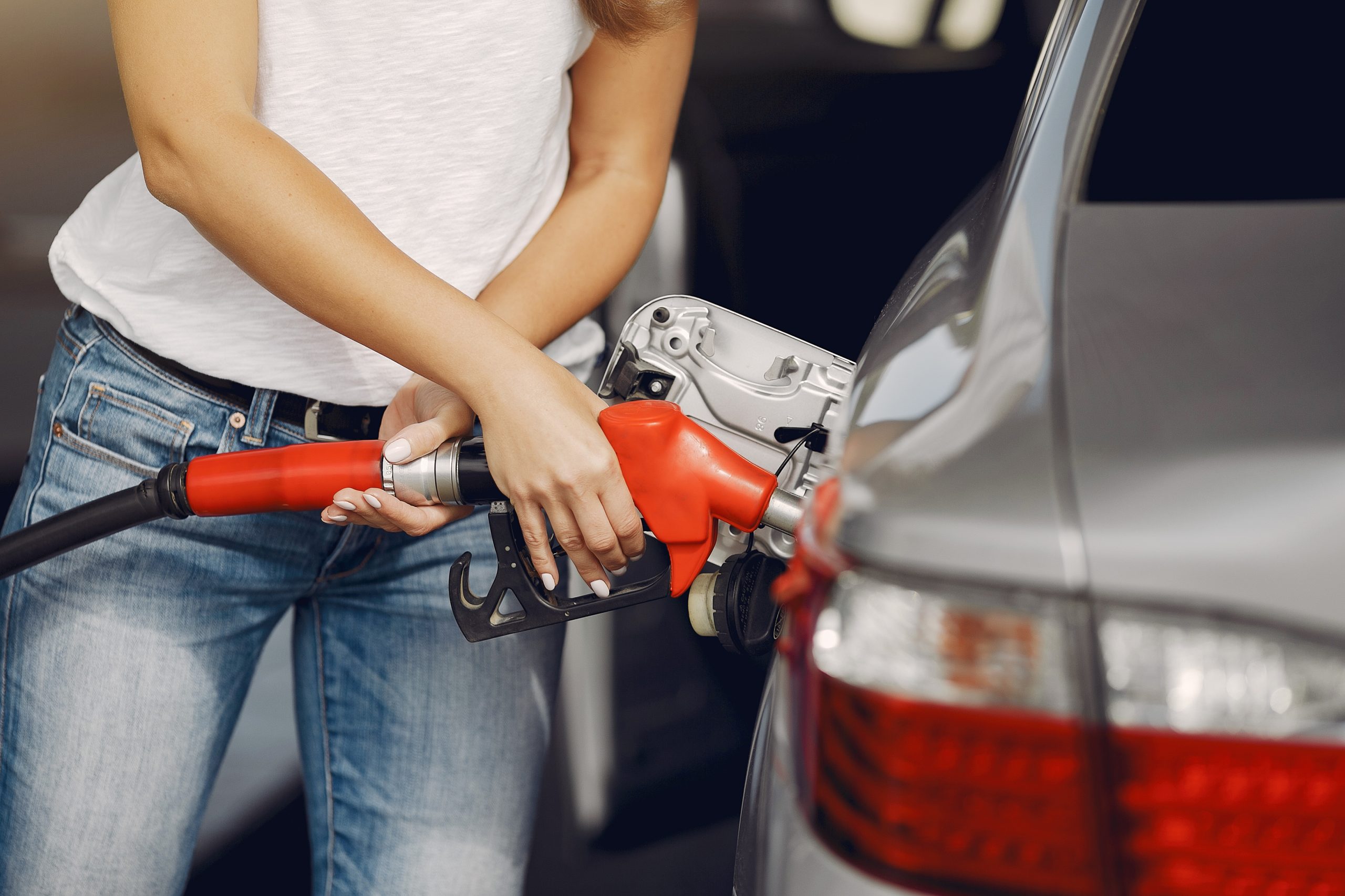 elegant woman standing gas station scaled